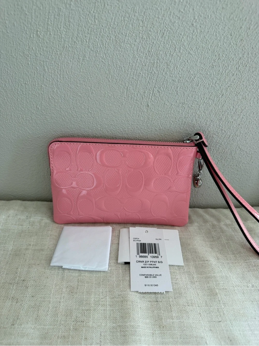 Coach Pink Corner Zip Signature Embossed Leather Wristlet with Heart Charm NWT